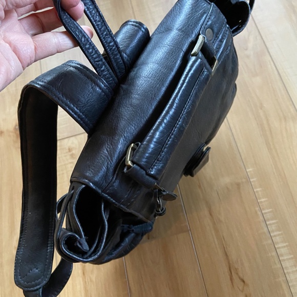 Rare Leather Back pack . Color is black . Brand is Latico . main image 4